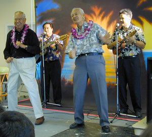 Fred and Sam Kamaka entertain the crowd with a hula at the induction of their father Samuel Kamaka at ʻUkulele Expo 2000